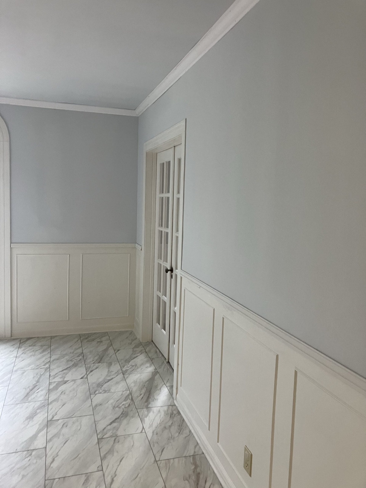 Interior remodel with fresh paint, wainscoting and tile floor